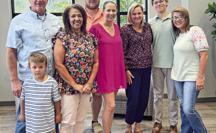 On front row from left are Elijah Cole, Angie Cole, Kaite Cole-Ford, Julie Jones, Will Jones and Ashley Cole-Guillory. On back row are Larry Cole and Jeffrey Ford.