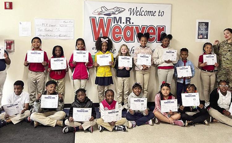 MR Weaver Terrific Kids for April are Front Row: 3rd grade – Massiah Brown, Cason Medlock, Legend Sam, Lucas Dorsey, Journee Anderson, Naiya Perry, Britnei Vargas, Asia Aaron, Prosperity Bryant, and Dayanna Valencia. On Back Row: 3rd grader Rylee Brown; 4th grade – Timothy Raphiel, Jeremiah Burrell, Alexis Wyble, McKenzie Walker, Annabel Riley, Nevah Smith, Shai Thomas, Zamarios Coleman, and Harlie Rogers; Kiwanian, Tiffany Gourdon.