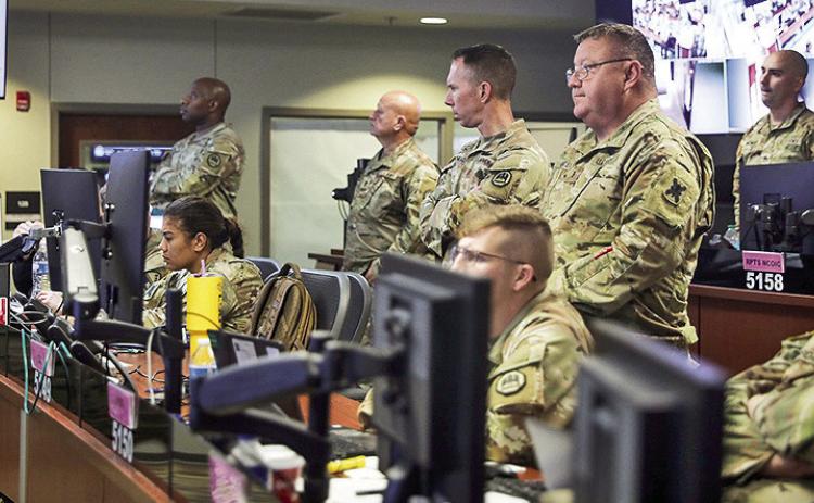 In response to the threat of Tropical Storm Francine, Soldiers and Airmen with the Louisiana National Guard reported to the Joint Operations Center at Louisiana National Guard Training Center Pineville, to assume liaison officer duties for each unit within the state, Sept. 10. The LANG is ready to support civil authorities in response activities, safeguarding the population, saving lives and protecting critical infrastructure. U.S. Army National Guard photo by Sgt. Danny Hough