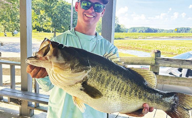 Pictured is Kolby Radford of Grand Cane, LA with the 10.6 lb largemouth bass he caught on Grand Bayou Reservoir in Coushatta on July 26, 2026. Kolby plans to have replica made of his fish. Grand Bayou Resort and Grand Bayou Reservoir District will pay for replicas of any bass caught at the lake that is over 10 pounds. If the fisherman wants a replica, the fish must first be officially weighed by resort personnel, then returned to the lake alive and in good condition. Photo credit Grand Bayou Resort staff.