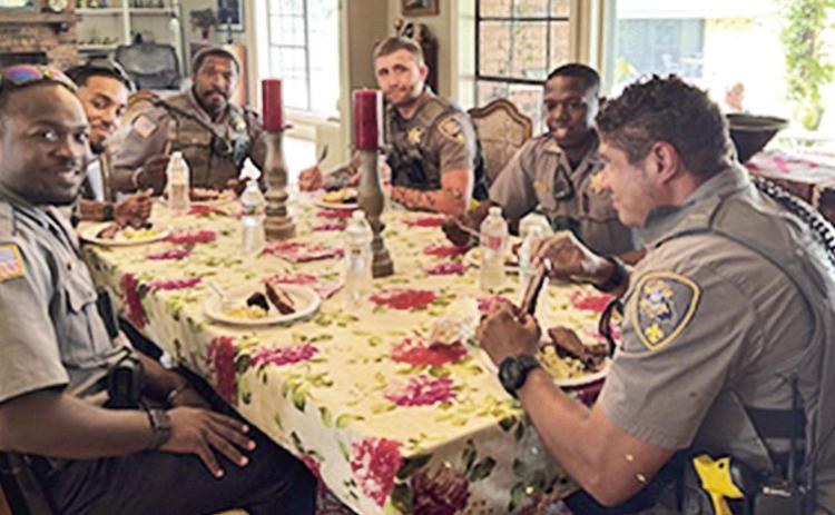 Natchitoches Parish Sheriff’s deputies enjoy a home-cooked meal prepared by NPSO Chaplain Marie Rose.