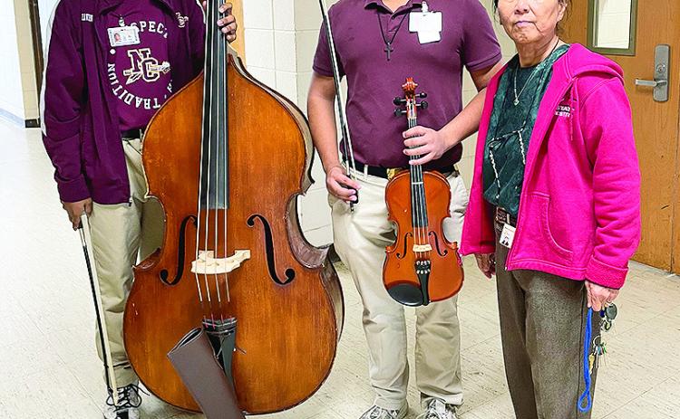 Two Talent Program students at NCHS, Zavion Sowell assisted by Milovan Paz and William Conklin assisted by Syll-Young Olson, were selected to the NATIONAL HONORS PERFORMANCE SERIES ORCHESTRA that will take place Feb. 6-11, 2024 at Carnegie Hall in New York, NY. From left are 9th grade Zavion Sowell on bass,12th grade William Conklin on viola, Syll-Young Olson, talent instructor. Not Pictured is Milovan Paz, talent instructor.