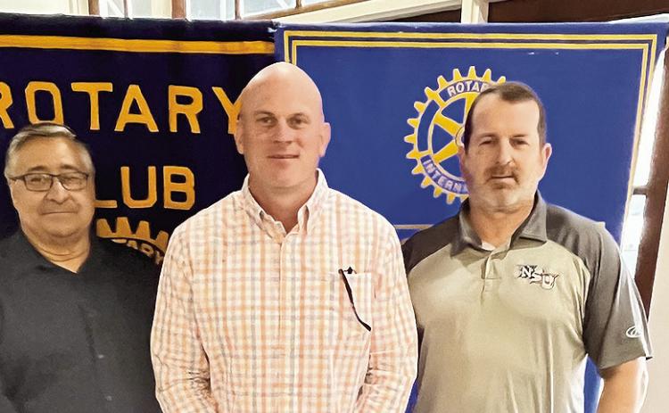 Rotarian with the Program Aaron Johnson introduced Northwestern State University Head Football Coach Blaine McCorkle at the March 12 Rotary luncheon. McCorkle shared the goals and objectives for the football program. From left Rotary President Joe Sers, McCorkle and Johnson.