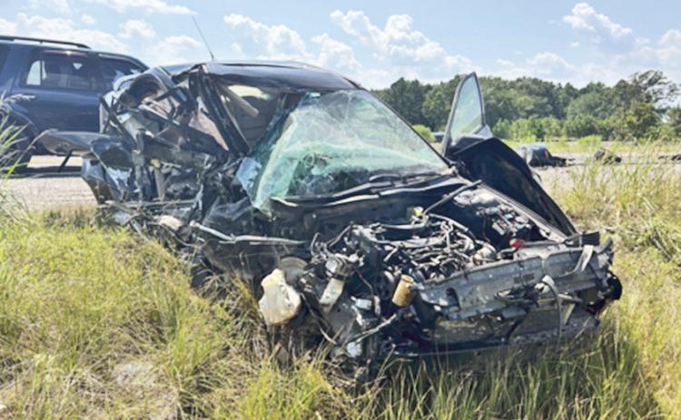 The driver of this vehicle suffered moderate injuries after colliding with a Mack truck.
