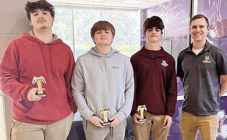 Natchitoches 4-H Esports team walked away as the Northwest Region Champions at the competition held at NSU on March 21. This team advances to the state competition held on the LSU Campus in Baton Rouge in June. Team members, from left, are Hayden Cunningham, Eli Hypes and Aubrey Allen, shown with Louisiana State 4-H Stem Specialist Brian Gautreaux.