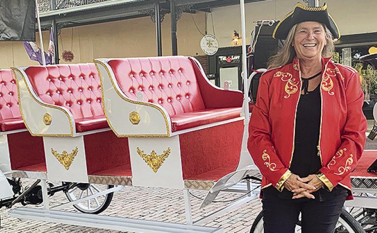 Pam Womack is a native of Natchitoches Parish. She is the daughter of Judy Montet. She has been operating horse drawn carriages for a long time on Front Street. Now Pam is operating an electric carriage for The Venue on Front Street.