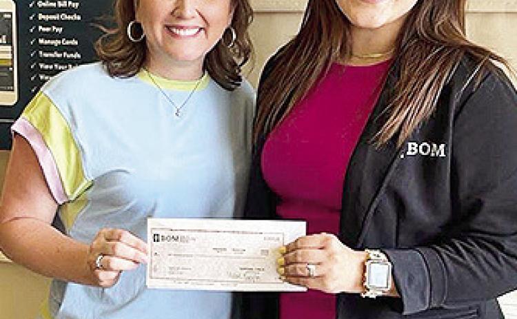 BOM is proud to support Fairview Alpha Elementary School as a sponsor of their 2024–2025 yearbook At FAE, students are encouraged to grow as caring individuals, creative thinkers, and confident problem solvers—and we’re honored to help celebrate their memories and achievements. Pictured from left are Molly McNeely and BOM’s Chelsea May.