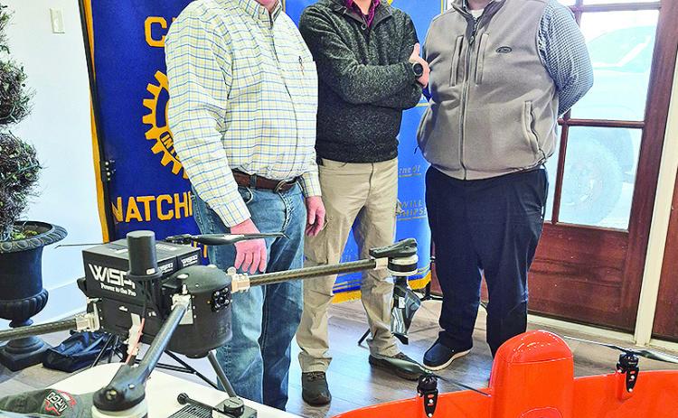 Rotary President Louie Bernard welcomed Northwestern State University Assistant Professor of Biology and Director of the Drone Lab JD Cox at the Jan. 27 meeting. Cox summarized the goals of the Drone Lab and the educational, certification and training services offered. Cox took two example drones. From left are Ken Guidry, Cox and President-Elect Josh Manuel.