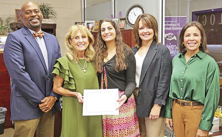 Tania Hernandez-Baullosa, a graduate student in Northwestern State’s Department of Psychology, is the inaugural recipient of the Susan Thorson-Barnett Grit Scholarship. From left are Department Chair Dr. Charles King, Thorson-Barnett, Hernandez-Baullosa, Clinical Director Dr. Cynthia Lindsey and Scholarship Coordinator Shannon Wall-Hale.