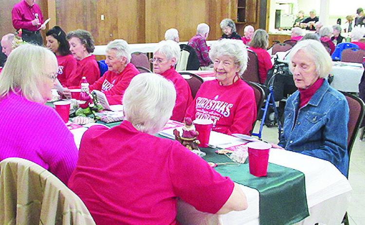 Members of every denomination are welcome at Young at Heart the first Wednesday of every month. The group met Dec. 4 at First United Methodist Church. In photos below, Roxanne Lane accompanied Nettles Brown who led the members and guests in a sing-along.