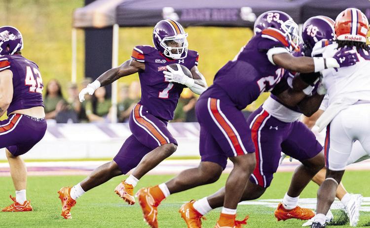 Zay Davis (middle) had 199 all-purpose yards in NSU's season-opening loss to Louisiana Christian. Credit: Chris Reich, NSU Photographic Services
