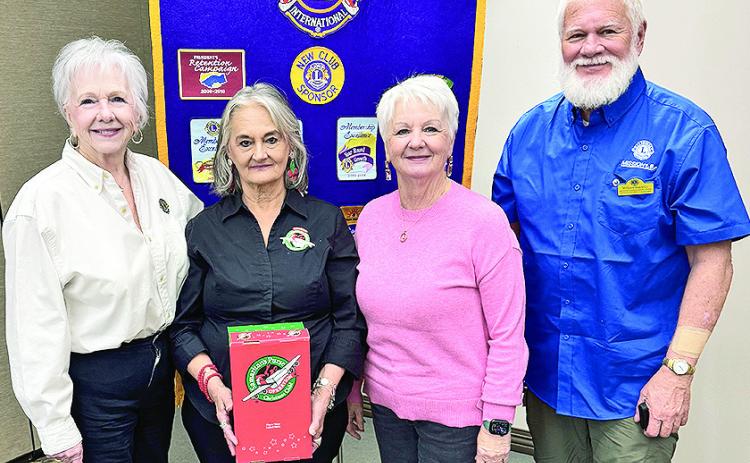 From left are Lion Mimi Stoker, Operation Christmas Child Volunteers Brenda Ingram and DeeDee Perot and Lion Bill Buckley.