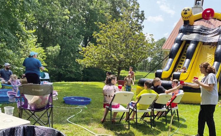 Kids played on huge water slide outside of Old Bethel Baptist Church last Saturday. Natalie, friend of Linda Bynog, served drinks to kids at Old Bethel Baptist Church Saturday.