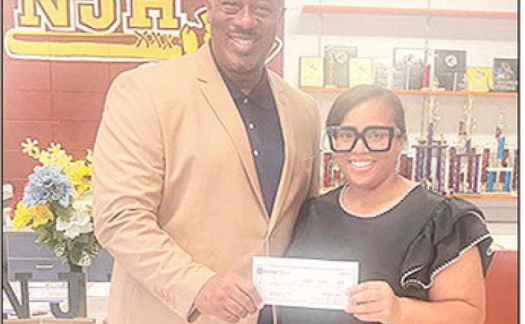 BOM Bank presented a check to Natchitoches Jr. High School in support of the Cheer Team. BOM’sJaliyahJoseph said, “We love cheering on the students in our communities as they work hard, build confidence and represent their schools with pride. Here’s to a great season filled with school spirit, teamwork and plenty of Chiefs’Cheers.” Pictured from the left are NJH Principal Bobby Benjamin and Joseph.