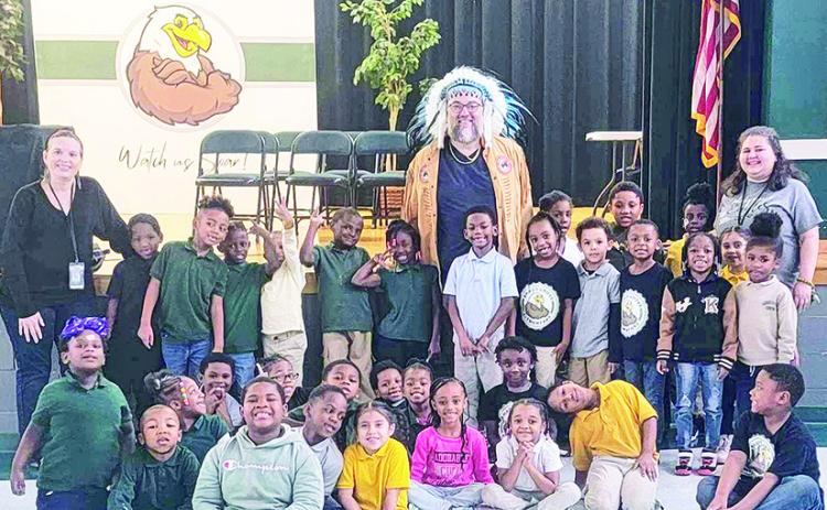 Butte Tribe Mission Director and Pastor Tim Stample (standing at center) teaches Native American culture and traditions.