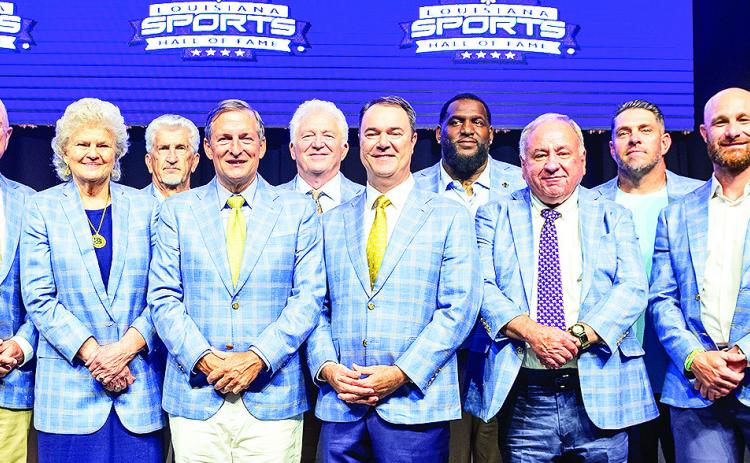 The Louisiana Sports Hall of Fame Class of 2026 poses following Saturday’s induction ceremony. On front row from left are John Brady, Kathy Holloway, John James Marshall, Warren Morris, Gil Lebreton and Jonathan Lucroy. On back row are Dewain Strother, Mike McConathy, Pat Williams and Todd McClure.