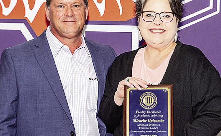 Michelle Holcombe was named the 2024 recipient of NSU’s Faculty Excellence in Academic Advising Award, which recognizes a faculty member for their mentorship and commitment to student success. Steve Hicks, director of Academic Engagement and Student Success, presented the award.