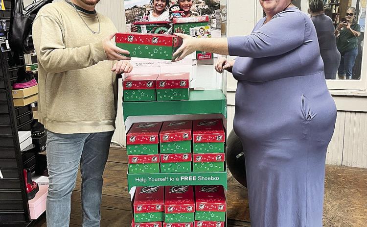 Kate Speed was eager to give Garrett Wells a shoebox to pack.