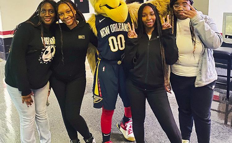 From left are Iyrlen Horn, Myricle Hart, Pierre the Pelican, Amia Randolph and Kaylei Shelvin.