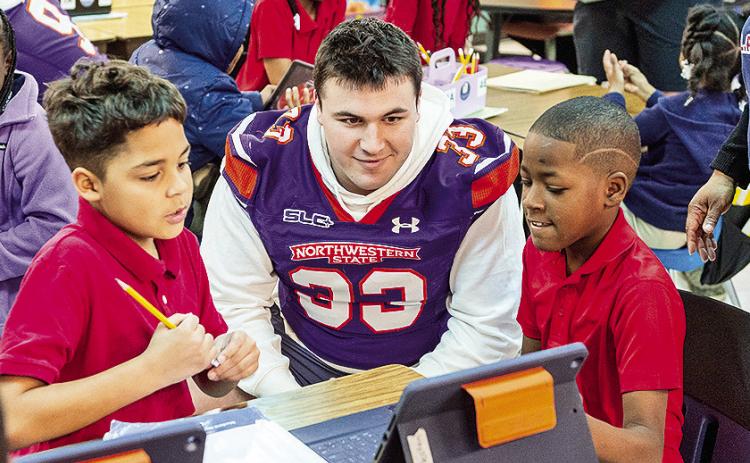 It has been 21 years Saturday since Chris Waddell’s death, and it brings back memories for Camryn Davis and Braden Woods, as both players went back to their old elementary school to help commemorate the life of Waddell. Photo by Chris Reich, NSU Photographic Services
