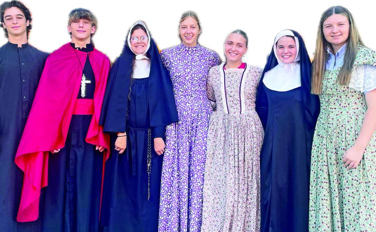 St. Mary’s sophomores portrayed historical characters from their church’s history. From left are Michael French, Abram Nichols, Ethel Guidry, Molly Smith, Jolee Savell, Peyton Faucheaux and Rayanna Norsworthy.
