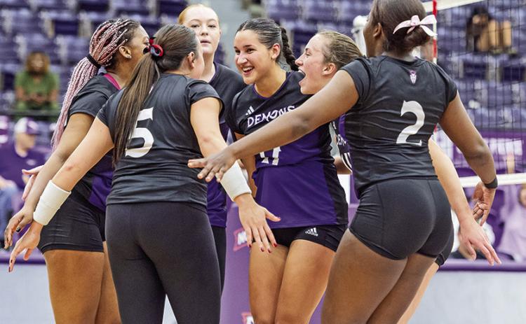 The NSU volleyball team huddles after a point in the match against Texas A&amp;M-Commerce. Photo by Chris Reich, NSU Photographic Services