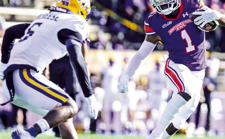 Northwestern State receiver Twon Hines (1) cuts upfield against McNeese’s Javon Davis on Nov. 16. Photo by Chris Reich/NSU Photographic Services
