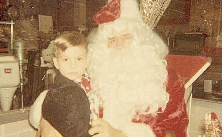 In this 1960s photo, columnist John Moore visited Santa and asked for a G.I. Joe. He got one. Photo by Mary Moore