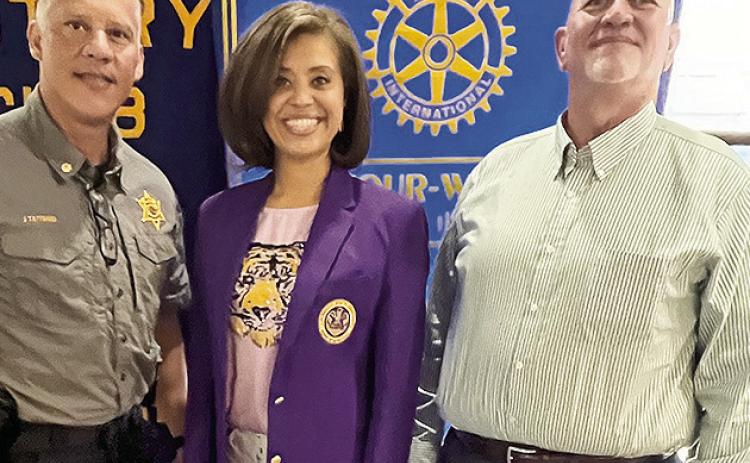 Rotarian with the Program Mark Begnaud welcomed LSU Board Member Valencia Jones at the Aug. 13 Rotary luncheon. Jones reported on the activities of the LSU System in Louisiana. From left are President Jesse Taitano, Jones and Begnaud.