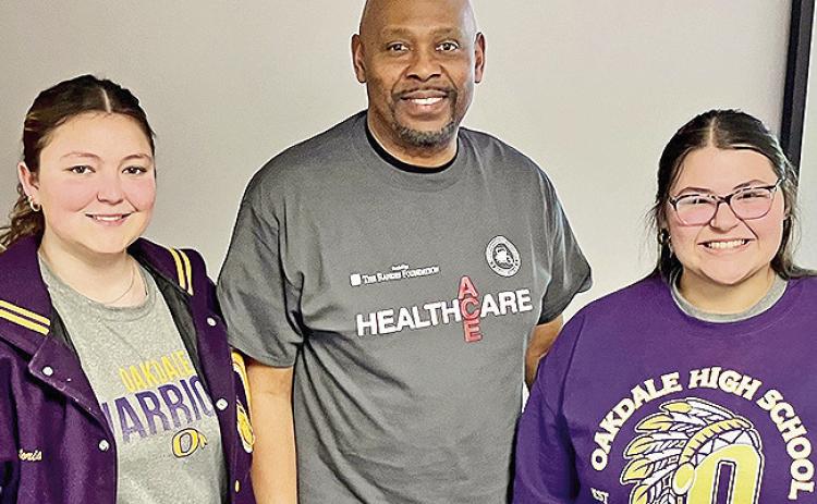 Dr. Charles King, center, interim head of NSU’s Department of Psychology, led interactive workshops about high demand healthcare careers during NSU’s Healthcare ACE event for Allen Parish students Friday. He visited with two 11th graders from Oberlin High School who are eager to enter the healthcare field. Victoria Trammel, left, is interested in pharmacy while Madelynn Johnson, right, is interested in nursing.