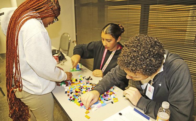 Tioga High School students Dylan Thomas, Andrea Acuna and Carson Cloud participated in a collaborative activity using Legos to create a calm and supporting environment, a skill applicable to the field of mental health counseling. The three participated in a Healthcare Academic and Career Exploration (ACE) event hosted by Northwestern State University.