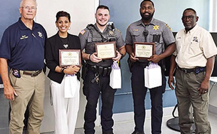 From left are Sheriff Stuart Wright, Dep. Beaudion, Sgt. Carlos D. Halliburton, De Thurman Miller Jr. and Chief Dep. Darrel Wynder