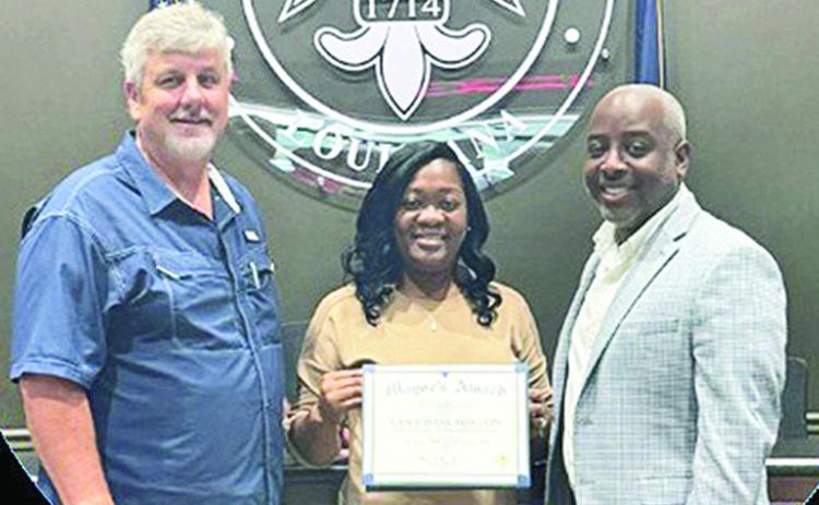 LaShonda Burton is the City April Employee of the Mont. She is an administrative assistant in the recreation department. Director Kevin Warner said she is very deserving of the honor, is a valuable employee and is the best record keeper he has ever seen. She has worked for the City nine years. From left are Warner, Burton and Mayor Ronnie Williams Jr.
