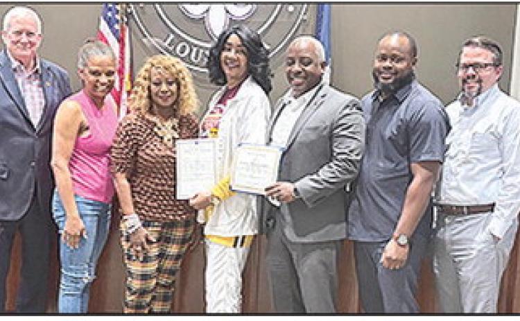 The City Council recognized Gloria Jean Armstrong Ibn Mohammed at the Council meeting Monday. Ibn Mohammed was a coach of the 1964 and 1965 Central High School Girls’ Basketball Teams that had success on the court and made it to the state finals both years. Mayor Ronnie Williams Jr. said her nickname was “The Rabbit.” From left are Councilpersons Dale Nielsen, Rosemary Eli and Betty Smith-Kirkendoll, Ibn Mohammed, Mayor Ronnie Williams Jr. and Councilmen Chris Petite and Eddie Harrington.