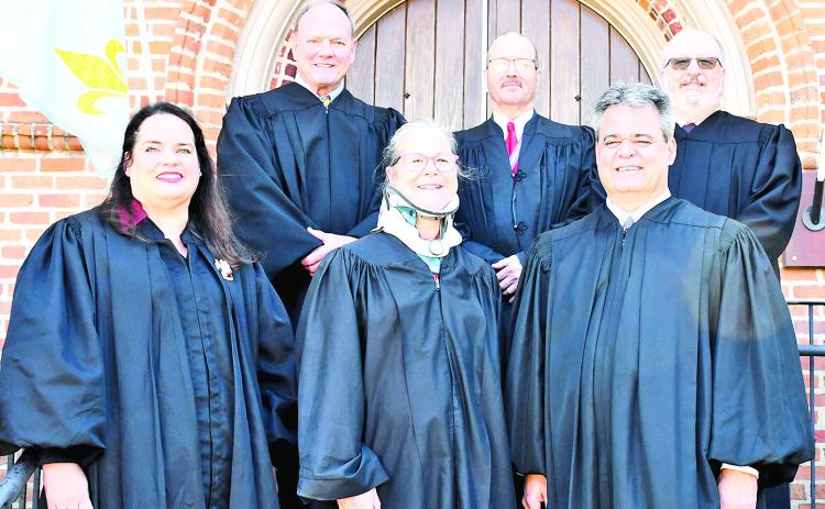 Front row from left are Judge Desiree Dyess, Judge Patricia Koch and Judge Greg Beard. On back row are Judge Van Kyzar, Hearing Officer Jacob Ruppert and Judge Rober Owsley.