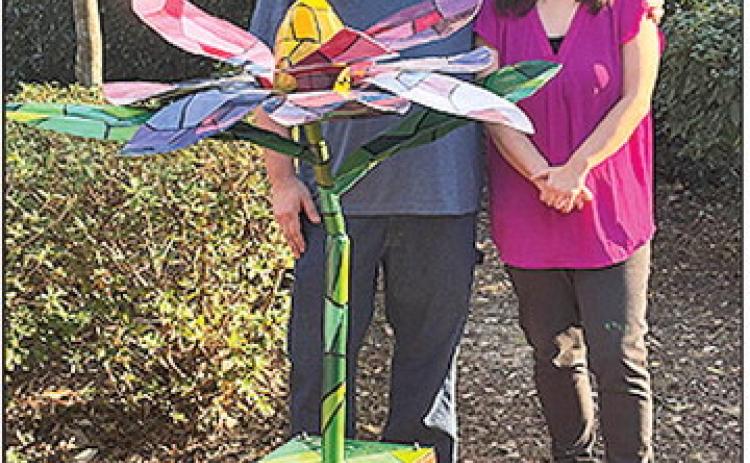 The Natchitoches in Bloom sculpture, Magnolia, was unveiled in the Susan Harling Robinson Memorial Park. Hanna Fulton created the art that was fabricated by NSU Professor of Art Corbin Covher. Fulton is associate professor of design at Louisiana Christian University.