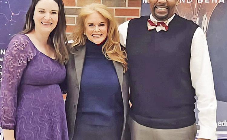 NSU graduate Hillary Bennett, center, is pictured with Sarah Ebarb-Combs and Dr. Charles King.