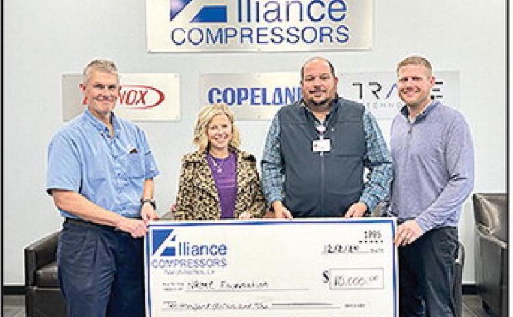 Alliance Compressors donated $10,000 to the Natchitoches Regional Medical Center Foundation. From left are Alliance Compressors Plant Manager Brian Brock, NRMC Foundation Development Director Halie Errington, Foundation Marketing Manager Stewart Caroline and Alliance Operations Manager Dillon Powell.