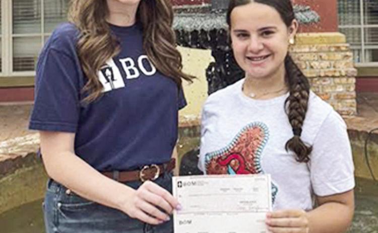 BOM sponsored barrel racer Brenley Metoyer, who has qualified for the NBHA Teen World Championship in Perry, GA. Pictured from left are BOM’s Erin Anderson and Brenley Metoyer.