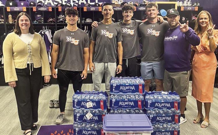 Fork ’Em Demons. BOM Bank is the official bank of NSU Athletics and to support our Demons on and off the field BOM donated cases of water and a snack tub to fuel the team for their trip to UTRGV. From left BOM’s Claire Mayeaux, Brody Belanger, Sam Ardoin, Brooks Leonard, Colton Harrison, Head Coach Chris Bertrand and BOM’s Carrie Hough.
