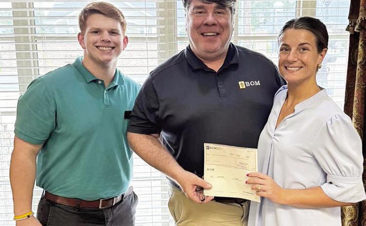 BOM sponsored the Natchitoches Coastal Conservation Association Banquet. The organization is dedicated to conserving Louisiana’s marine resources. Pictured from left are BOM’s Levi Endris, David Guillet, and Mary Scruggs.