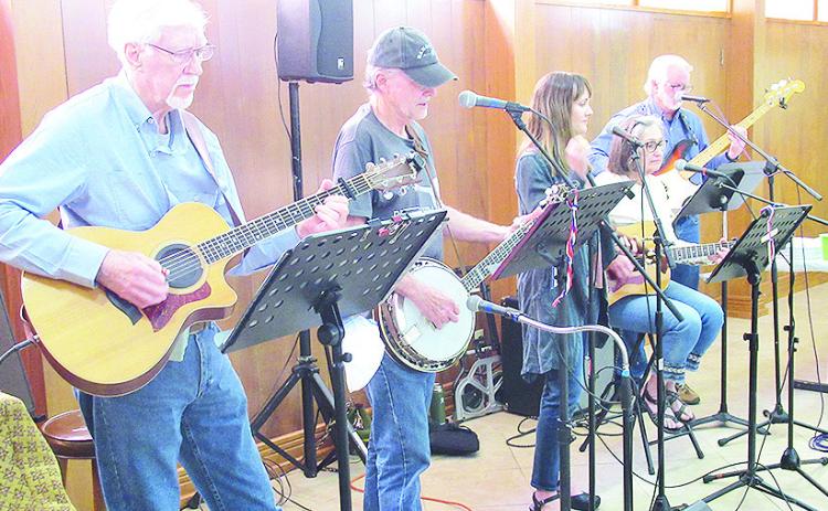Home Grown Tomaters Band entertain those attending Young-at-Heart at First United Methodist church.