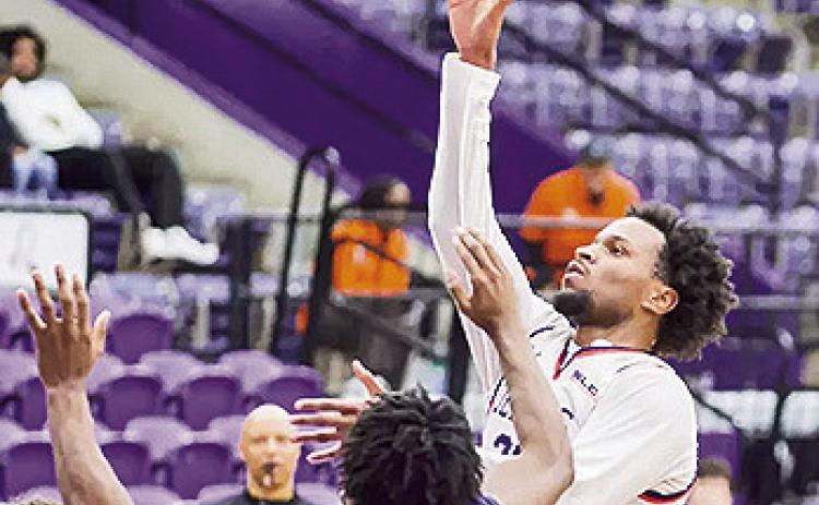 Willie Williams hits the go-ahead layup with four seconds left to end their seven-game losing streak at Beaumont, defeating Lamar 70-68. Photo by Chris Reich, NSU Photographic Services