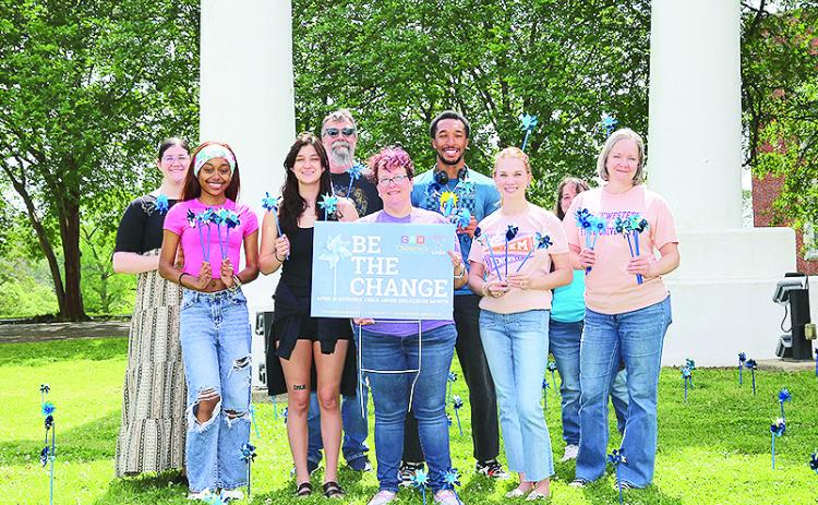 Students and faculty from NSU’s Department of Social Work planted pinwheels for Child Abuse Prevention Month. From left are Amelia Lewis of DeRidder, Ariel Williams of Logansport, Marina Moorehead of Alexandria, Byron McKinney, Lisa Mount, Jacobie McCormick of Franklinton, Kirby Peddy, Sherrie Davis and Jennifer Shaw.