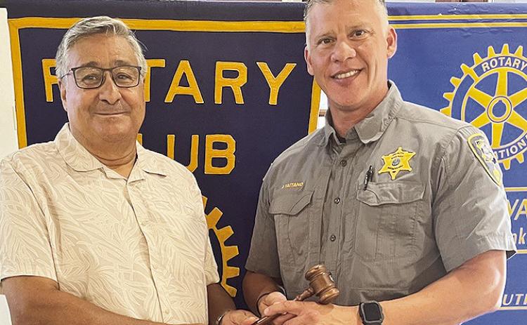 At the July 2 Rotary luncheon, President Joe Sers, left, hands the gavel to the President-elect Jesse Taitano. The Rotarians would like to express their appreciation for the work that both Sers and Taitano have done as president and president-elect.