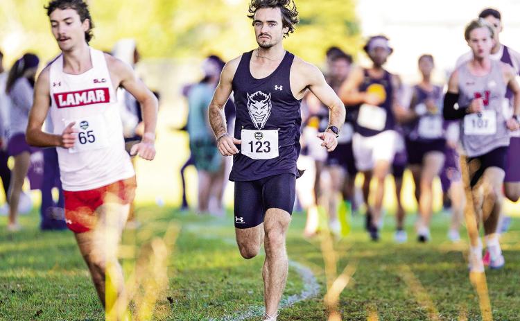 Competing in his final Southland Conference Cross Country Championships, John Klein (pictured, center) earned another personal best with a time in the 8K of 25:22.0 to lead nine Demons or Lady Demons who earned personal bests at the meet. Photo by Chris Reich, NSU Photographic Services