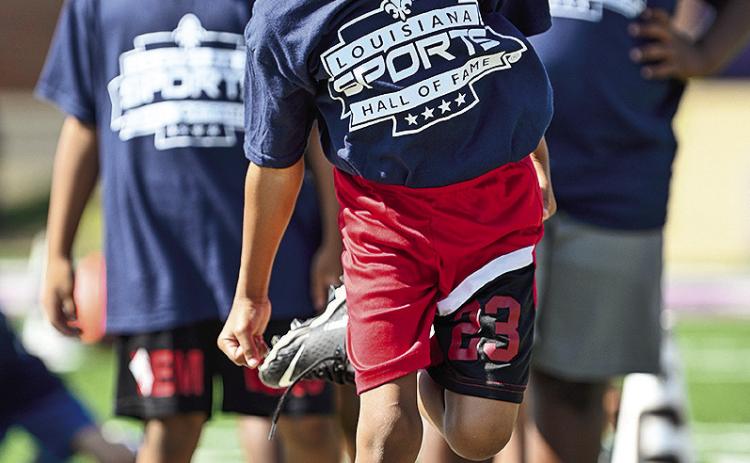 The Louisiana Sports Hall of Fame didn’t forget about the kids. This youngster goes through the drill at the Jr. Training Camp for kids at Northwestern State Saturday. Photo courtesy of Sports Hall of Fame