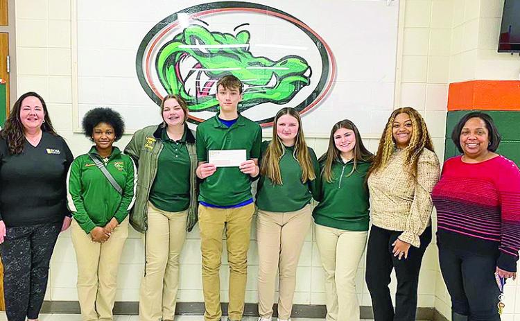 BOMFS a sponsor of Lakeview Junior and Senior High School’s Travel Club. This unique club affords students the opportunity to experience educational travel and the ability to make connections between what they learn in the classroom and real life experiences. From left are BOMFS’s Reba Phelps, club members Tamia Lloyd, Macey Jarnagin, Nathaniel Garner, Natalie Green, Hailey Jarnagin, teacher Chanda Goff and Principal Karla Renter.