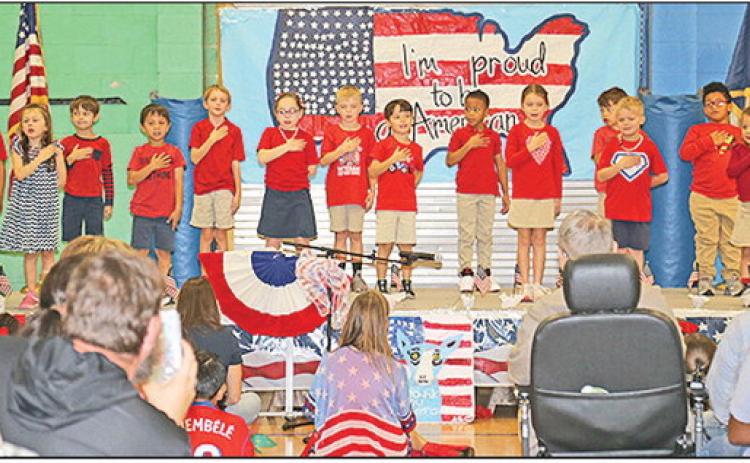 Kindergarten students sang a patriotic song thanking veterans for their service during.