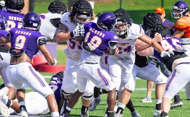 Isaiah Ybarra (left) blocks Emanuel Brown (19) during Monday’s practice. Photo by Chris Reich/NSU Photographic Services